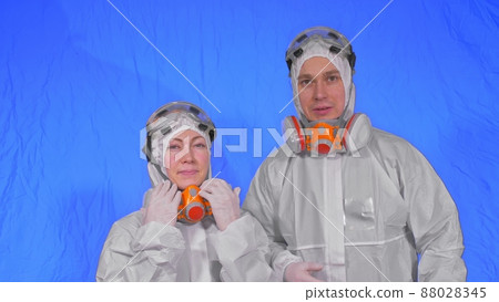 Doctor health worker in respirator. Slow motion. People portrait, wearing protect medical antibacterial antiviral aerosol spray paint mask. 88028345