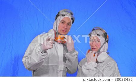 Doctor health worker in respirator. Slow motion. People portrait, wearing protect medical antibacterial antiviral aerosol spray paint mask. 88028485