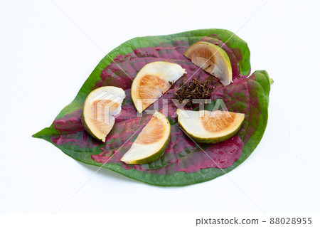 Chewing betel nut, Betel nut with cal lime powder on betel leaves Chewing betel nut, Betel nut with cal lime powder on betel leaves 88028955