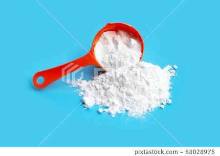Baking soda on blue background. Baking soda on blue background. 88028978