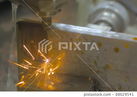 Wire cutting machine working with metal workpiece with sparks 88029541