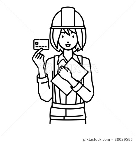 A woman at a construction site standing and holding documents and cards A woman at a construction site standing and holding documents and cards 88029595