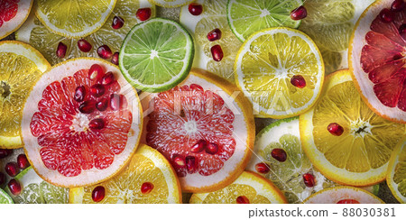 citrus slices with pomegranate seeds, top view citrus slices with pomegranate seeds, top view 88030381