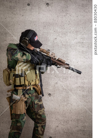 A man holding a gun A gun 88030430