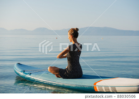 Woman meditating in peaceful morning Woman meditating in peaceful morning 88030506