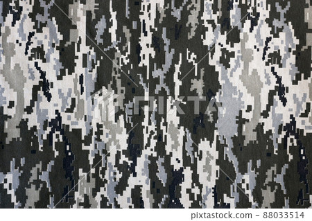 Fabric with texture of Ukrainian military pixeled camouflage. Cloth with camo pattern in grey, brown and green pixel shapes. Official uniform of Ukrainian soldiers Fabric with texture of Ukrainian military pixeled camouflage. Cloth with camo pattern in grey, brown and green pixel shapes. Official uniform of Ukrainian soldiers 88033514