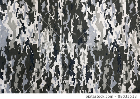 Fabric with texture of Ukrainian military pixeled camouflage. Cloth with camo pattern in grey, brown and green pixel shapes. Official uniform of Ukrainian soldiers Fabric with texture of Ukrainian military pixeled camouflage. Cloth with camo pattern in grey, brown and green pixel shapes. Official uniform of Ukrainian soldiers 88033518