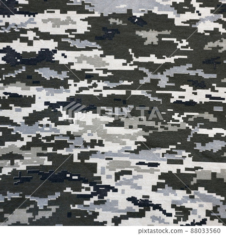 Fabric with texture of Ukrainian military pixeled camouflage. Cloth with camo pattern in grey, brown and green pixel shapes. Official uniform of Ukrainian soldiers 88033560