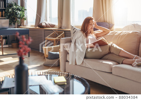 Reading literature. Woman at home with a book 88034384