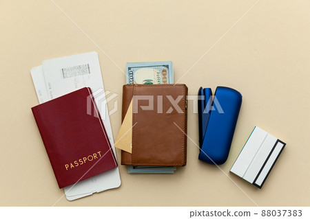Iqos electronic blue cigarette on a beige background. Iqos electronic blue cigarette on a beige background. 88037383