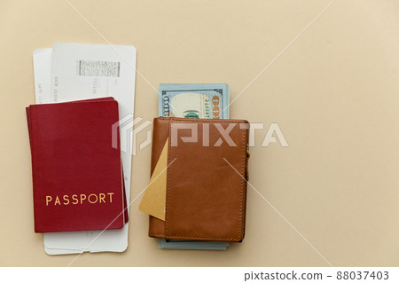purses with money on a beige background. purses with money on a beige background. 88037403