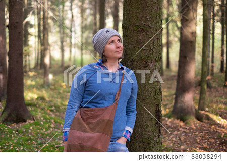 Young woman resting after a walk in the forest 88038294