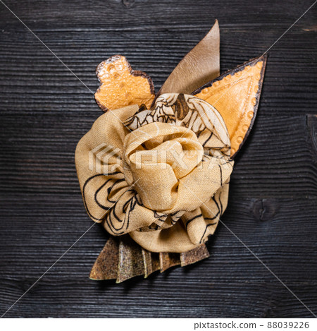 top view brown leather and silk brooch as flower 88039226