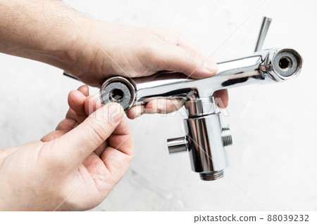 top view of plumber hands install paronite gasket 88039232