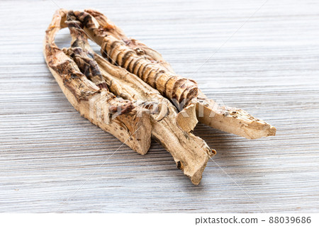 dried Sweet flag (calamus) roots on wooden table 88039686