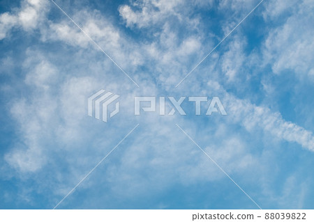 Light blue sky with white clouds. Creative sky background for celebration and season decoration. A backing of vanilla sky for branding, calendar, multicolor card, banner, cover, website. A place for Light blue sky with white clouds. Creative sky background for celebration and season decoration. A backing of vanilla sky for branding, calendar, multicolor card, banner, cover, website. A place for 88039822