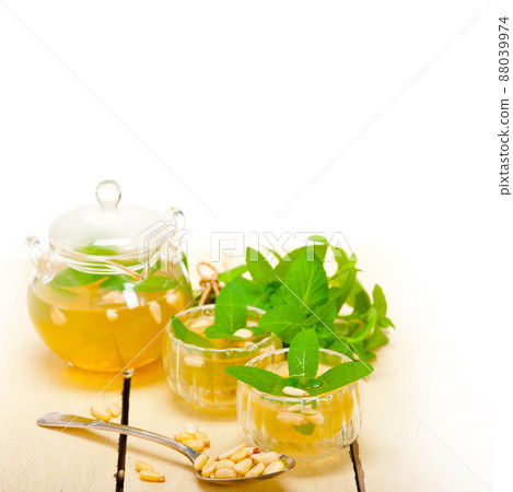 Arab traditional mint and pine nuts tea Arab traditional mint and pine nuts tea 88039974
