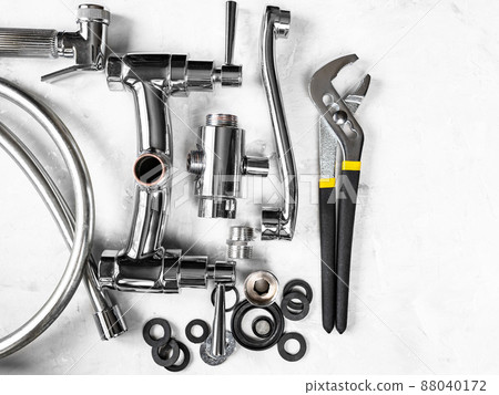 top of wrench, disassembled faucet with copyspace 88040172