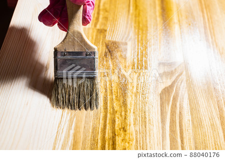 wooden board is covered with wood stain close up wooden board is covered with wood stain close up 88040176