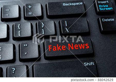 Fake News enter key on the black pc keyboard. Spread false information in the media concept.  88042629