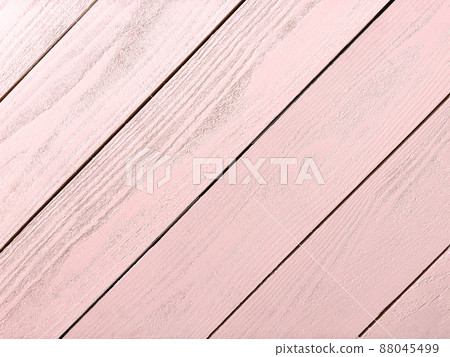 Horizontal background image of diagonal board with wood grain painted in pale pink Horizontal background image of diagonal board with wood grain painted in pale pink 88045499
