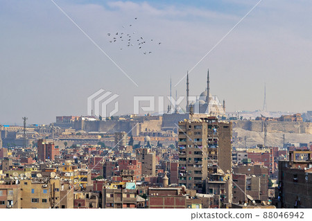 Aerial cityscape view of old Cairo, Egypt with old buildings and Citadel of Egypt in far distance Aerial cityscape view of old Cairo, Egypt with old buildings and Citadel of Egypt in far distance 88046942