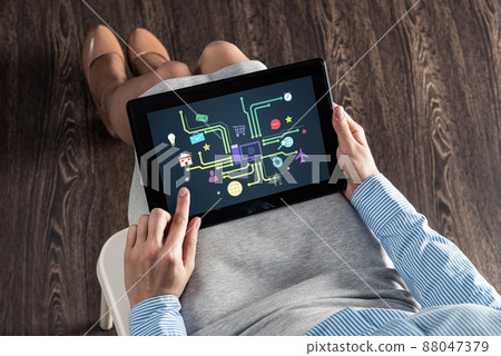 business woman with tablet on her lap 88047379
