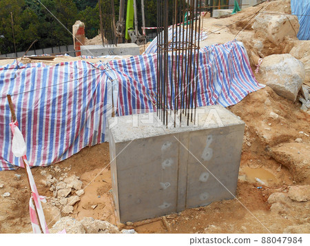 SELANGOR, MALAYSIA -JULY 4, 2021: The concrete pile cap and column stump are under construction at the construction site. Both are part of the building's foundation system. SELANGOR, MALAYSIA -JULY 4, 2021: The concrete pile cap and column stump are under construction at the construction site. Both are part of the building's foundation system. 88047984