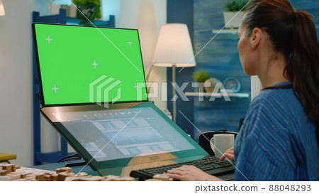 Woman architect using green screen for building model and architectural construction. Engineer looking at mockup template and isolated background for development. Horizontal chroma key Woman architect using green screen for building model and architectural construction. Engineer looking at mockup template and isolated background for development. Horizontal chroma key 88048293