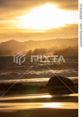 Nice sunset sunlight in a windy day over the waves in Costa Brava of Spain Nice sunset sunlight in a windy day over the waves in Costa Brava of Spain 88048910