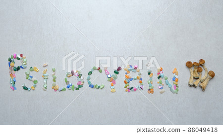 "Psilocybin" inscription. Psychedelic mushrooms on textured background. "Psilocybin" inscription. Psychedelic mushrooms on textured background. 88049418