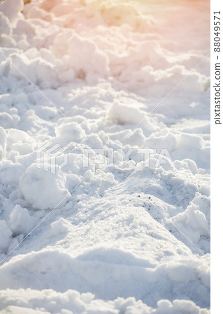 Uneven snowdrift of loose snow. Winter background. It's frosty day. Uneven snowdrift of loose snow. Winter background. It's frosty day. 88049571