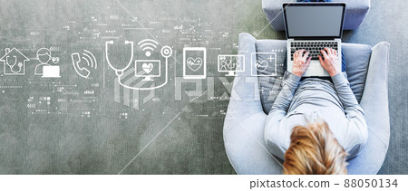 Telemedicine theme with man using a laptop Telemedicine theme with man using a laptop 88050134