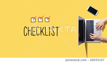 Checklist with person working with laptop 88050167