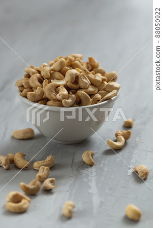 group of nuts on grey concrete background, healthy food concept 88050922