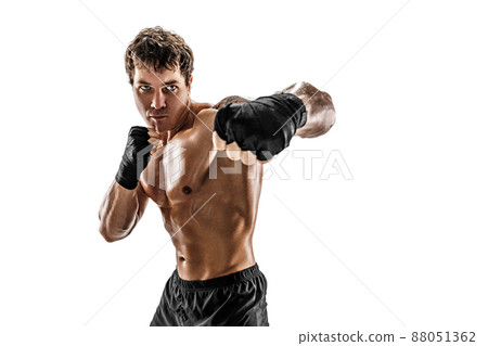 Studio shot of aggressive boxer who training and practicing swing on white background. Sport concept 88051362