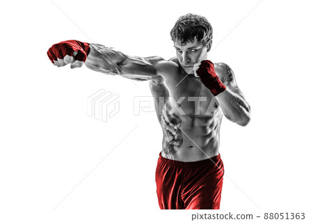 Portrait of boxer who practicing jab on white background. Black and white. Red sportswear Portrait of boxer who practicing jab on white background. Black and white. Red sportswear 88051363