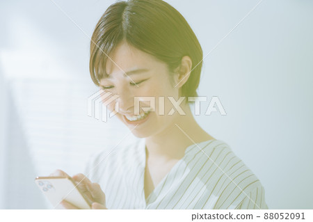 Smile woman smartphone operation Smile woman smartphone operation 88052091