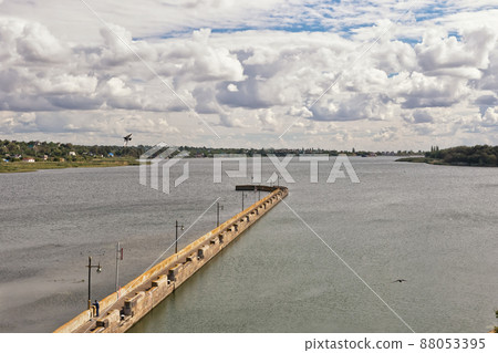 A long concrete pier in front of the gateway of the navigable channel A long concrete pier in front of the gateway of the navigable channel 88053395