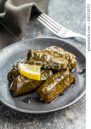 Dolmades. Stuffed vine leaves. Greek appetizer on plate. 88053833