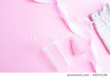 Menstrual cycle sanitary cup. Pink ribbon with menstrual cup. Menstruation feminine period. Sanitary hygiene banner. Use menstrual cup inside vagina. Menstrual cycle sanitary cup. Pink ribbon with menstrual cup. Menstruation feminine period. Sanitary hygiene banner. Use menstrual cup inside vagina. 88054196