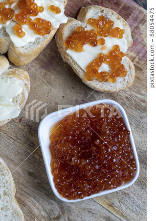 natural red salmon caviar with baguette and butter 88054475