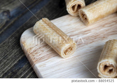 wheat waffles twisted during dessert preparation wheat waffles twisted during dessert preparation 88054525