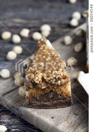sweet and delicious cake with nuts and caramel sweet and delicious cake with nuts and caramel 88054549