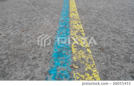 Ukrainian flag colors on asphalt, yellow, blue freedom, world peace. Ukrainian flag colors on asphalt, yellow, blue freedom, world peace. 88055455