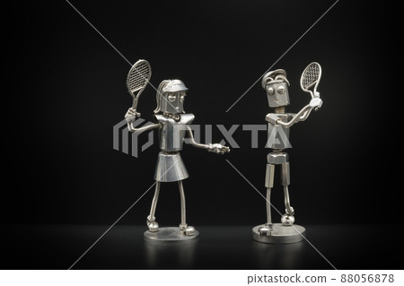 Couples and metal figures enjoying tennis Couples and metal figures enjoying tennis 88056878