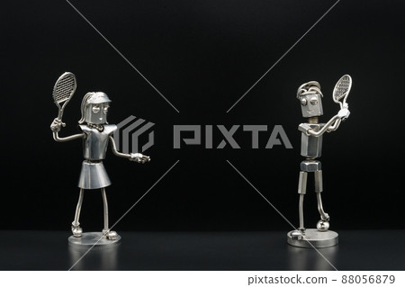Couples and metal figures enjoying tennis Couples and metal figures enjoying tennis 88056879