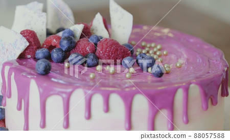 Amazingly beautifully hand-decorated homemade strawberry cake. Delicious, fresh, appetizing dessert close-up. Confectionery art. 88057588
