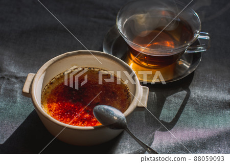 Tea time through the trees, tea and creme brulee Tea time through the trees, tea and creme brulee 88059093