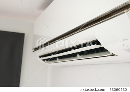 Air conditioner on white wall room interior background Air conditioner on white wall room interior background 88060580